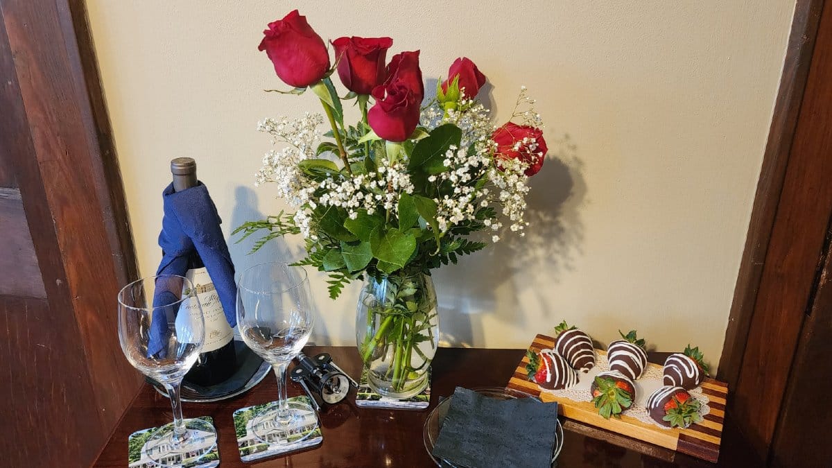 All You Need Is Love romance package at Vine Cottage Inn featuring wine, roses, and chocolate-covered strawberries