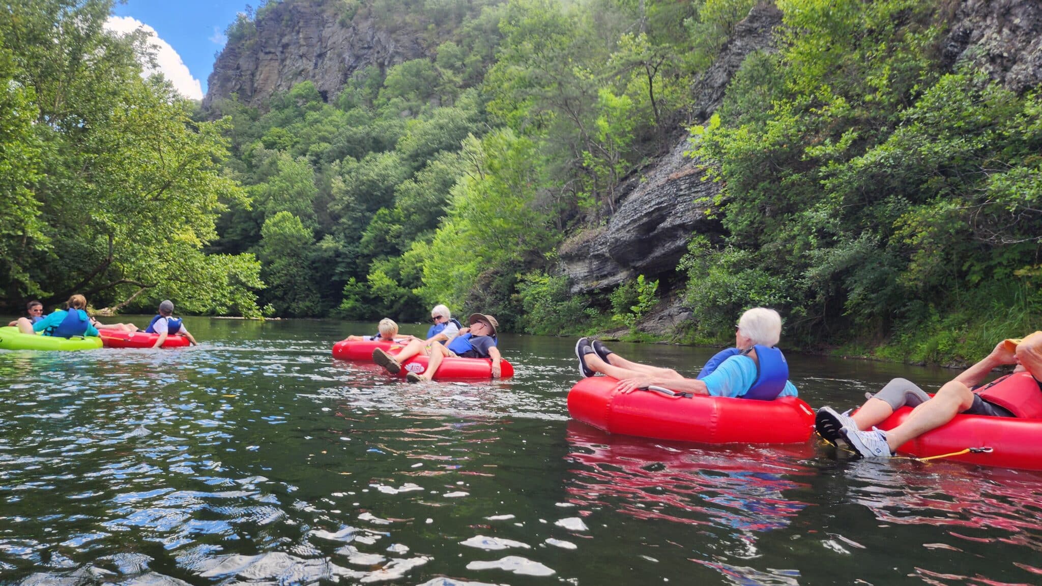 Guests enjoying river tubing in Bath County Virginia during summer.
