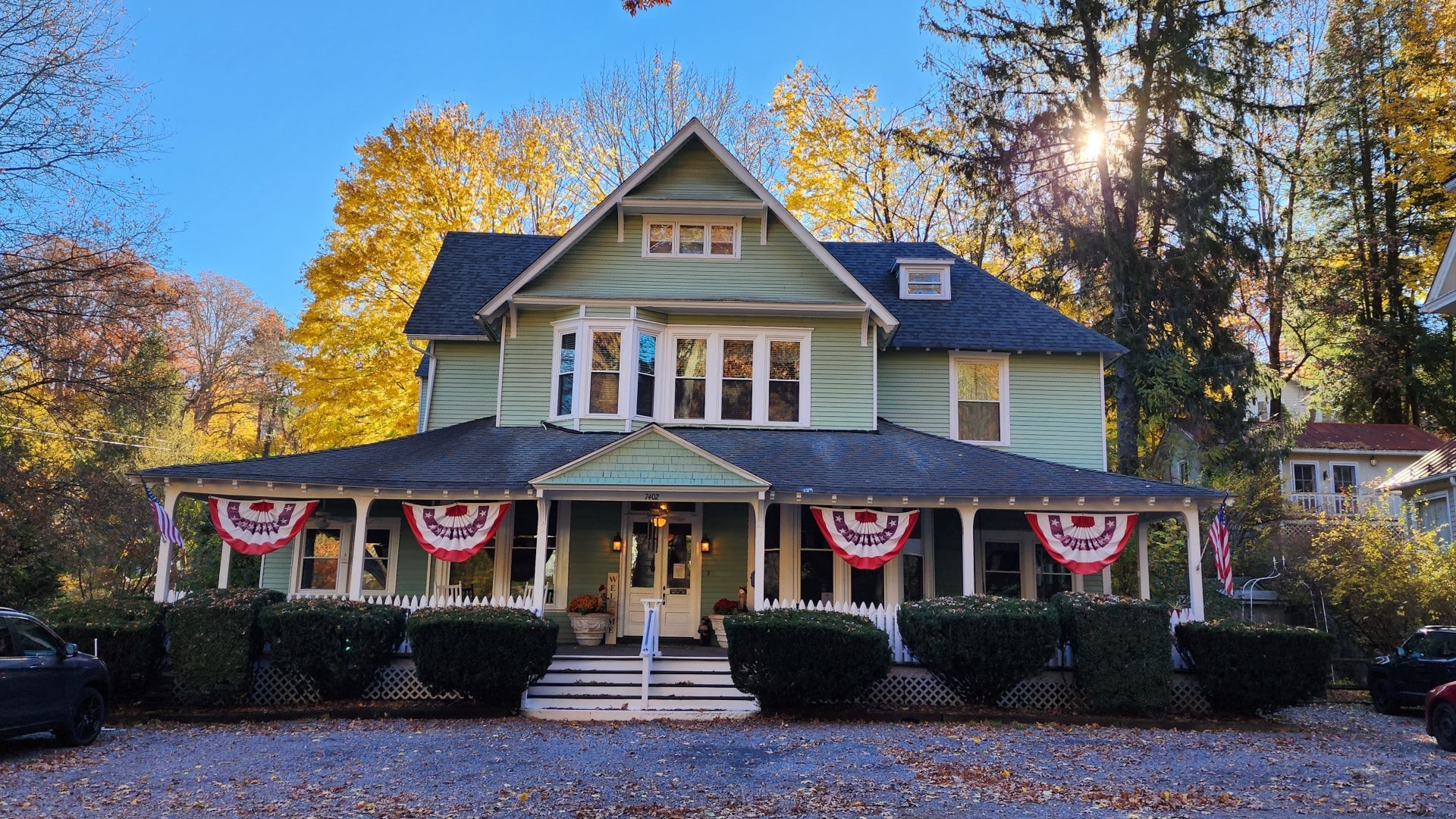 Vine Cottage Inn surrounded by golden fall foliage in Hot Springs, Virginia